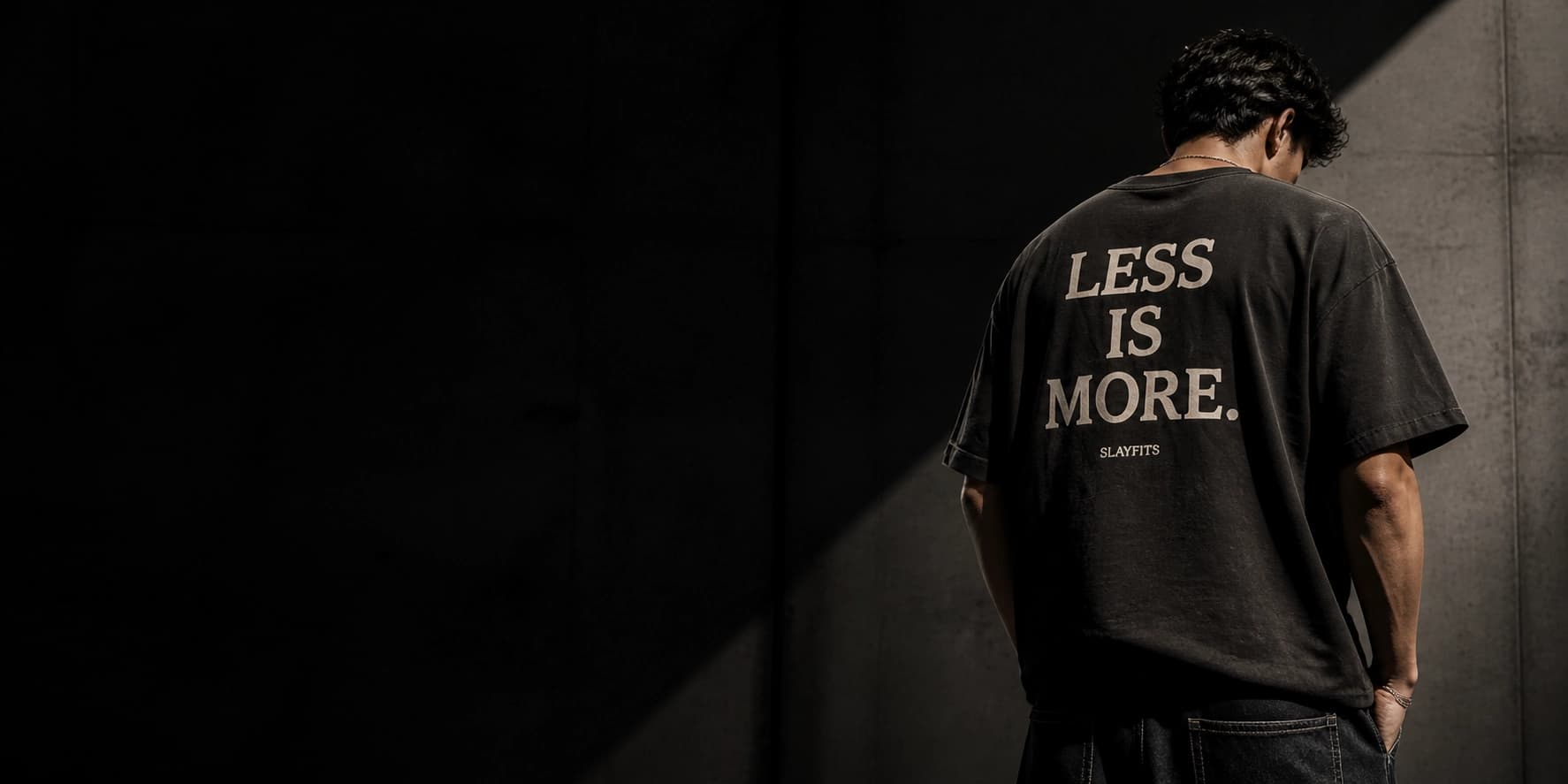 Model wearing a SLAYFITS monochrome oversized tee